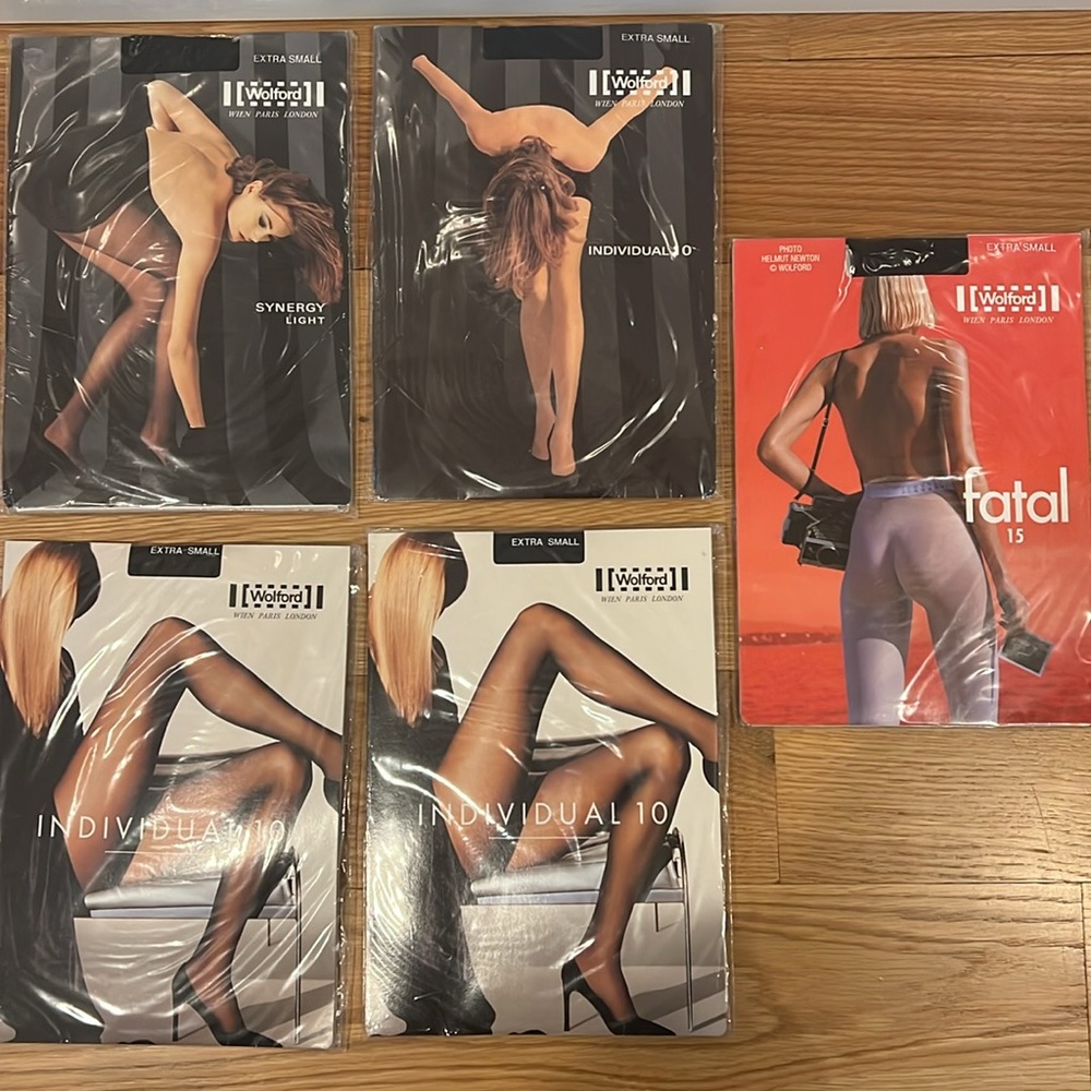 Wolford tights. 5 unopened packages. All size x-small. 3 black, 2 admiral.